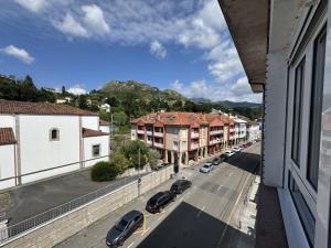 a view of a street with cars parked on the road at Alojamiento Picos de Europa VUT-2458-AS in Arriondas