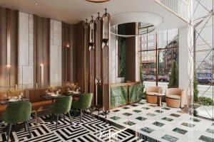 a lobby with a table and chairs and a building at GRAND SOL LUXURY BOUTIQUE Hotel in Hanoi