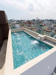 a swimming pool on the roof of a building at GRAND SOL LUXURY BOUTIQUE Hotel in Hanoi