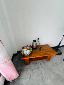 a table with a bowl of eggs and a kettle on it at Ella Hermitage View in Ella