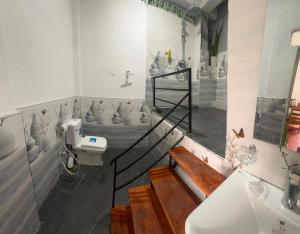 a bathroom with a sink and a toilet at Ella Hermitage View in Ella