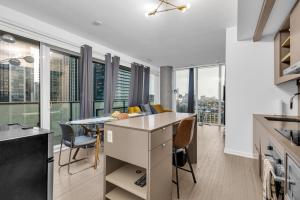 an open kitchen and dining room with views of the city at Toronto Skyline Center Hotel in Toronto +15 photos