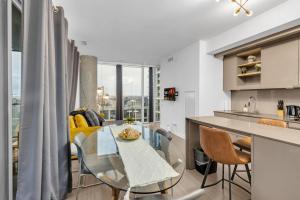 a kitchen and living room with a table and chairs at Toronto Skyline Center Hotel in Toronto