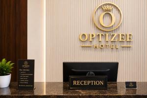 a hotel lobby with a sign that reads update hotel at Optizee Hotel and Suites in Agege