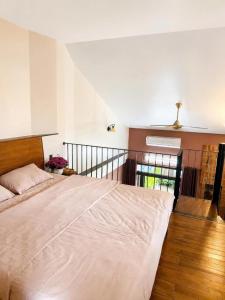 a bedroom with a large bed in a room at 2MINZ Homestay in Thôn An Hòa