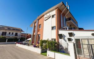 a store front of a building on a street at B&B Caricone in Orta Nova