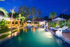 a swimming pool in a villa at night at Sunset Cave Villas Lembongan in Nusa Lembongan