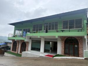 a building with a balcony on top of it at Double tree hill side resort 2 in Burhānilkantha