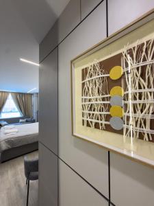 a room with a large painting on the wall at 7Boys Hotel in Amman +48 photos