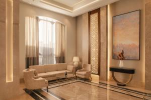 a living room with a couch and a window at Charmillion Gardens Aquapark in Sharm El Sheikh