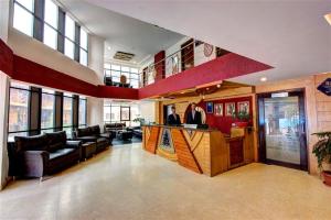 a large living room with a bar in a building at New Daffodil Classic Manali in Manāli