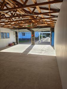 an empty parking lot with a building in the background at Harrison House in Featherston