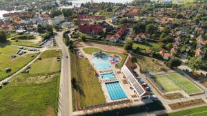 an aerial view of a resort with a swimming pool at La Rose Residence in Mikołajki