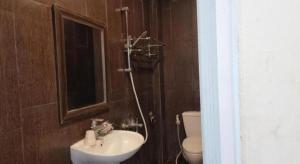 a bathroom with a sink and a toilet at RUBY HOTEL in Cà Mau +66 photos