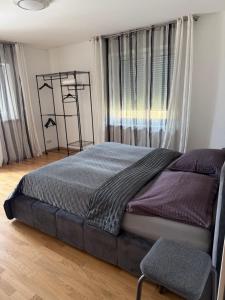 a bedroom with a bed and a chair at 2 Schlafzimmer Apartment Bergland 