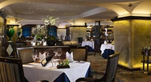 a dining room with tables and chairs in a restaurant at Hotel Lisboa in Macau