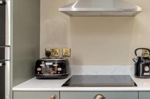 a toaster sitting on a counter in a kitchen at Marske Hall, Yorkshire Dales in Marske +76 photos