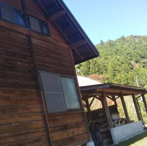 a log cabin with a roof and a porch at Haecho County - Camp - Vacation STAY 42289v in Oshite