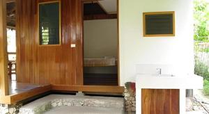 a bathroom with a sink and a mirror at Mayas Native Garden Resort in Basdiot +66 photos