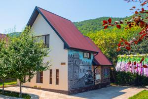 a building with a painting on the side of it at Quba Qala Resort in Quba