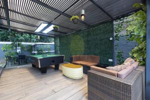 a patio with a pool table and a ping pong ball at Aduke's Residence Abuja in Abuja