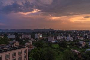 a view of a city at sunset at Perfectstayz Premium Mahadev Regency in Katra