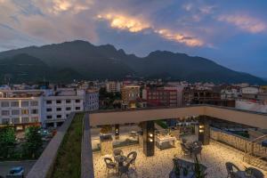 a view of a city with mountains in the background at Perfectstayz Premium Mahadev Regency in Katra +118 photos