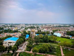 an aerial view of a city with buildings at 5 Mins from Prem Mandir 1 BHK Apartment in Vrindāvan