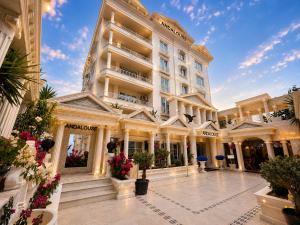 an exterior view of a building with a courtyard at Andalouse Otel in Trabzon