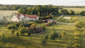 an aerial view of a house in a field at Viesu nams Kāpsargi in Ventspils