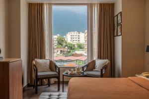 a hotel room with a view of a city at Perfectstayz Premium Mahadev Regency in Katra