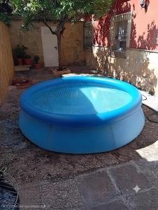 a blue frisbee is sitting in a pool at Como En Casa Jerez in Jerez de la Frontera