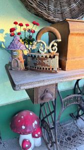 a wooden table with a box and flowers on it at Berkó Vendégház in Rákóczifalva +32 photos