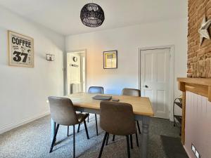 a dining room with a table and chairs at Waterloo Street in King's Lynn
