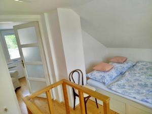 a small room with a bed and a chair at Funny Füred in Balatonfüred +48 photos