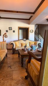 a living room with couches and a table at Grand Uchisar Hotel in Uçhisar