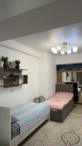 a bedroom with two beds and a room with at Радуга in Chon-Sary-Oy
