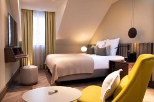 Postel nebo postele na pokoji v ubytování Hotel D Geneva