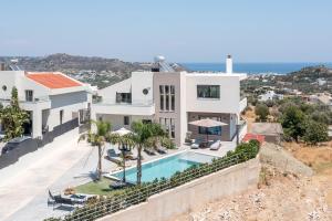 an aerial view of a house with a swimming pool at Aetheria Luxury Villa in Kalithies