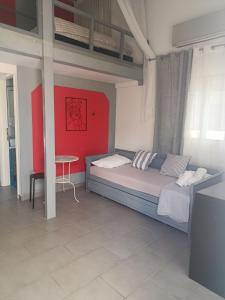 a bedroom with a bed and a table in it at Irida's House in Xylokastro