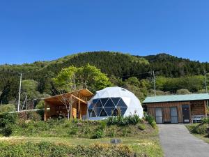 a house with a greenhouse next to a building at Base Camp Spring - Vacation STAY 35488v in Shibukawa