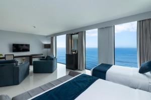 a hotel room with a bed and a view of the ocean at A'lanka luxury hotel in haputale in Walhaputenna