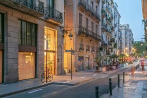 a bike parked on the side of a city street at Andante Princesa in Barcelona