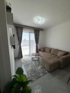a living room with a couch and a table at Etno Lux Isaković in Ulcinj