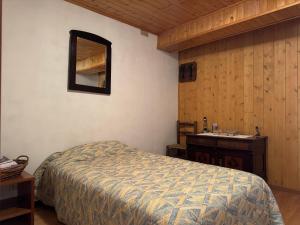 a bedroom with a bed and a sink at Casa Camomilla in Creto +10 photos