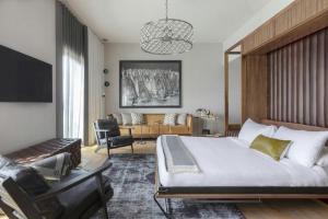 a bedroom with a large bed and a living room at Park James in Menlo Park +89 photos