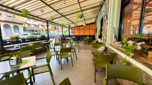 a restaurant with tables and chairs in a room at Etoile Affittacamere in Saint Vincent +28 photos