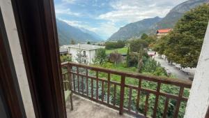 a balcony with a view of a city and mountains at Etoile Affittacamere in Saint Vincent