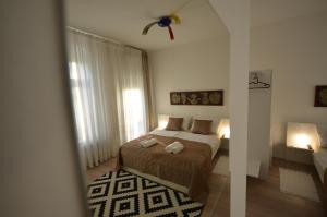 Posteľ alebo postele v izbe v ubytovaní Downtown Luxury Apartment