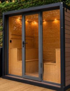 a greenhouse with glass doors on a deck at Shiners Shack in Newport